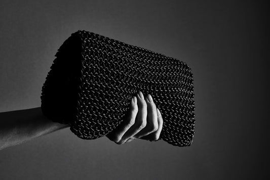 THE SIGNATURE CLUTCH